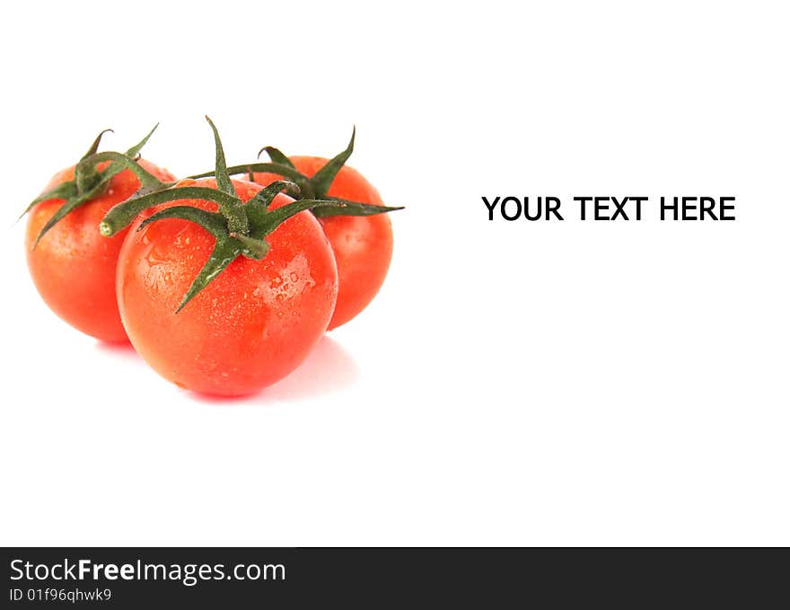 Macroshot of a bunch of tomatoes with drops of water. Isolated over white background. Lot of copyspace.