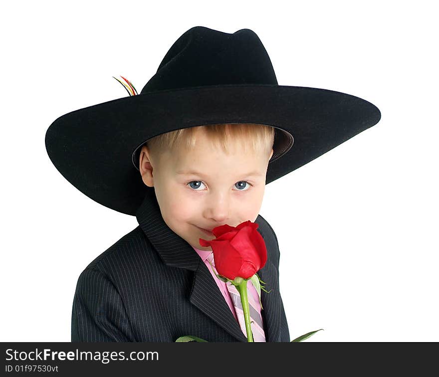 Little boy smelling a rose closeup portrait. Little boy smelling a rose closeup portrait