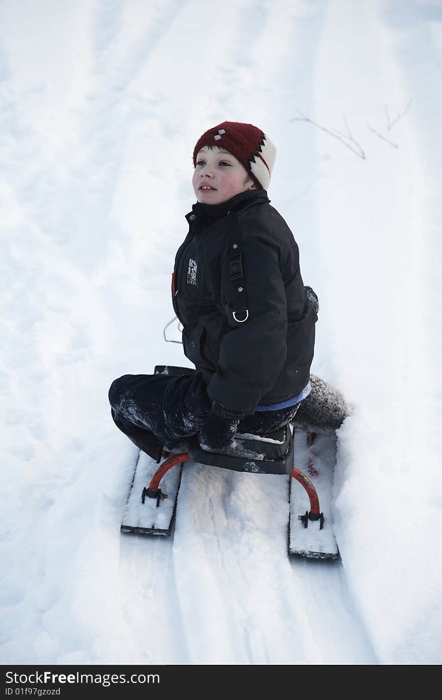 A boy on the sledge