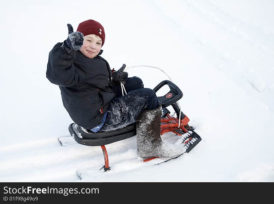 A boy on the sledge