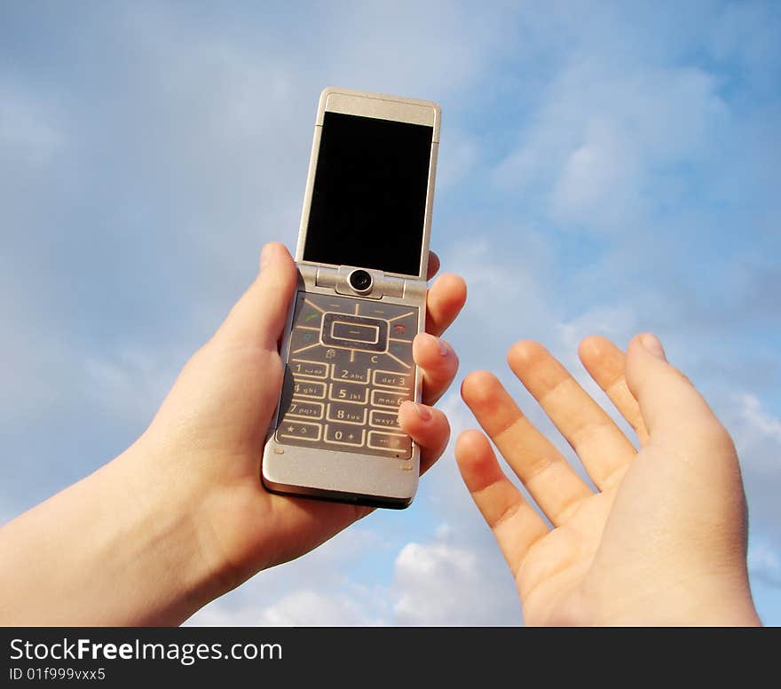 Hand holding a mobile phone for support