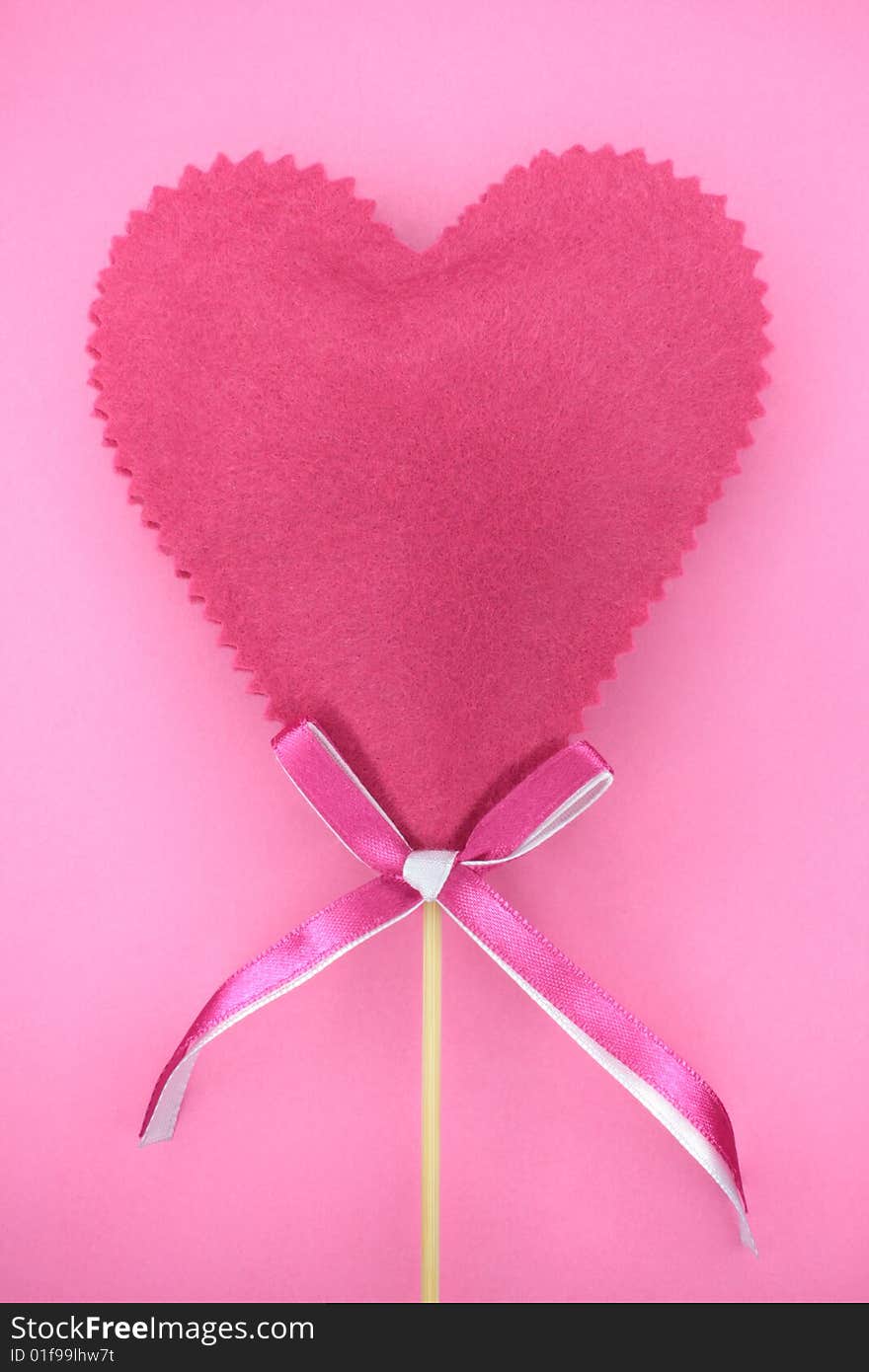 Pink heart on the pink background