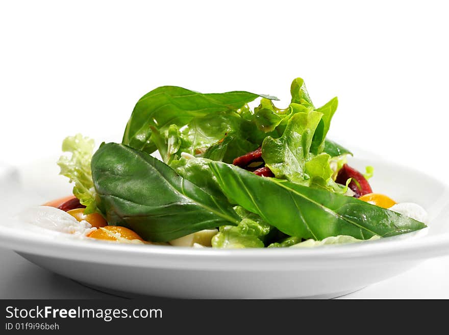 Salad - Smoked Magret (Duck Breast) with Red Chaud-Froid Sauce. Comprises Tomato and Vegetable Leaf. Isolated on White Background. Salad - Smoked Magret (Duck Breast) with Red Chaud-Froid Sauce. Comprises Tomato and Vegetable Leaf. Isolated on White Background