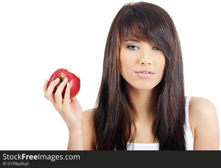 Beautiful young woman eating red apple. Isolated over white