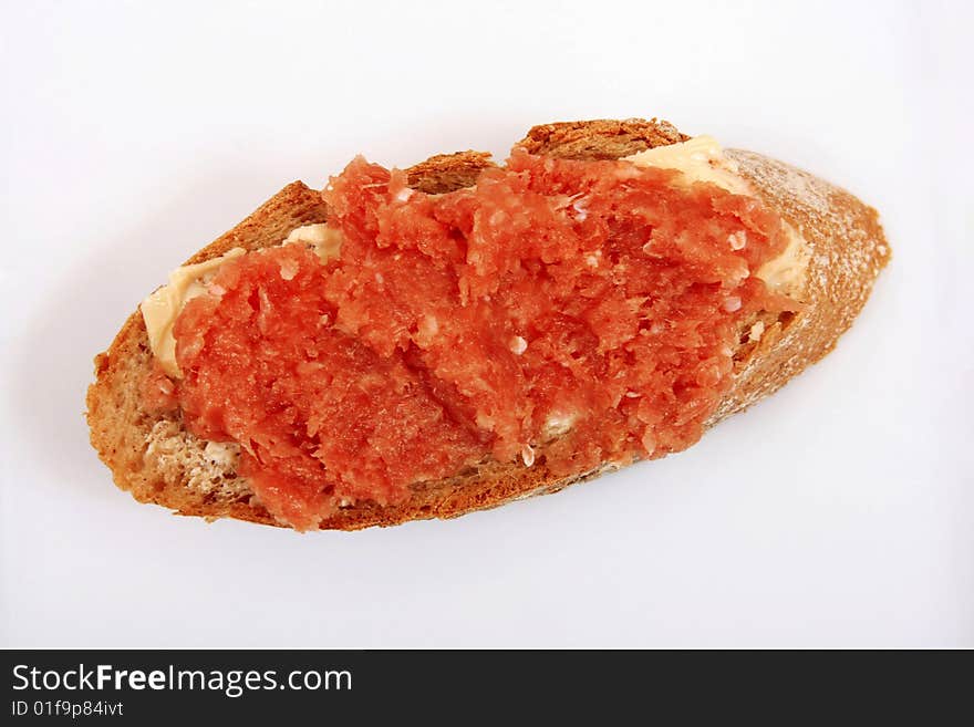 Slice of french bread with minced meat and butter