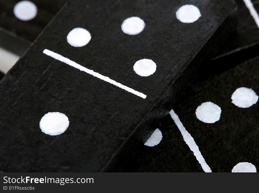 Close up of dominoes, black with white dots