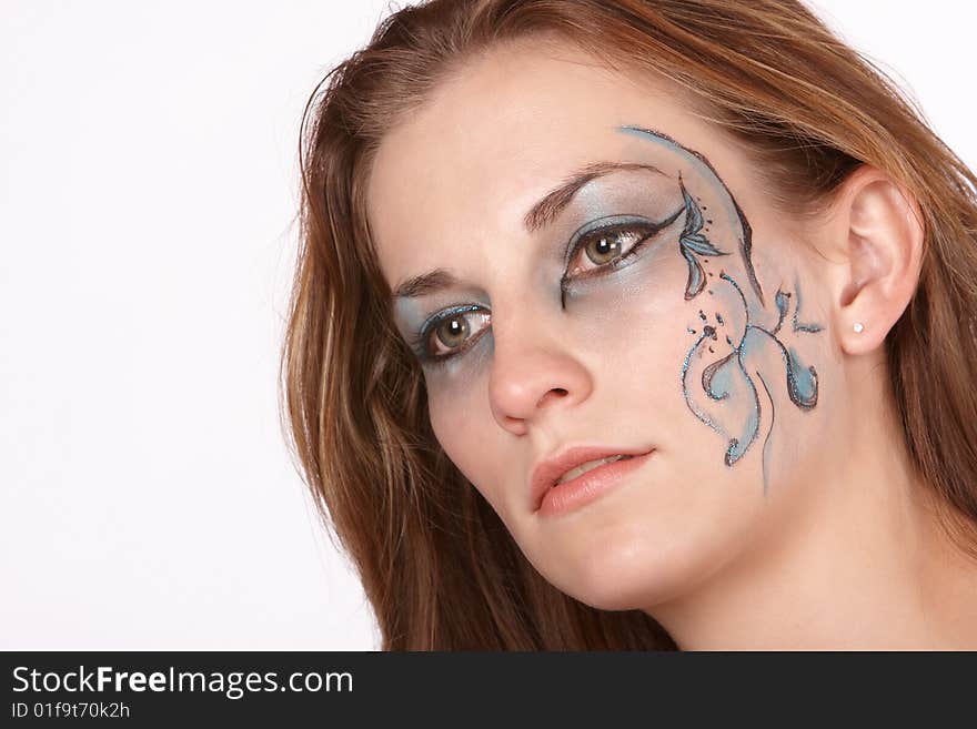 Dreamy far off expression in fantacy makeup model with long brown hair