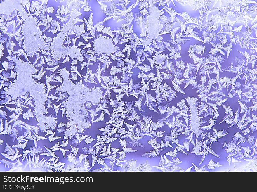 Frostwork on a window glass (as an abstract winter background)