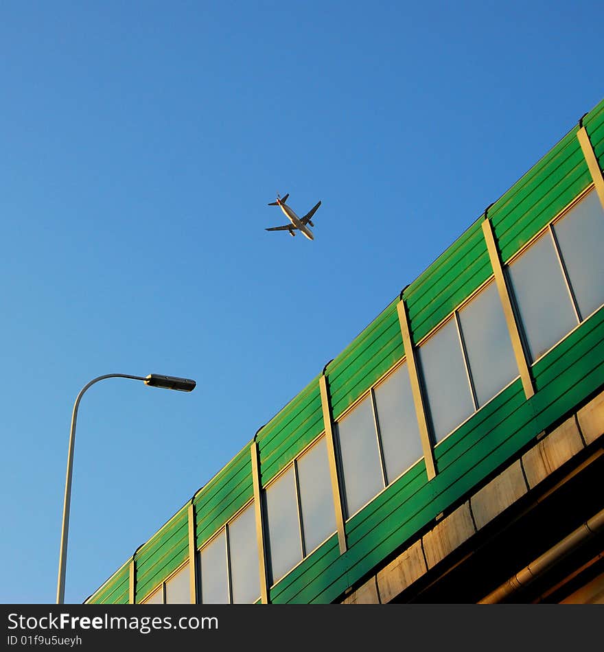 A plane just taking off, over the airport