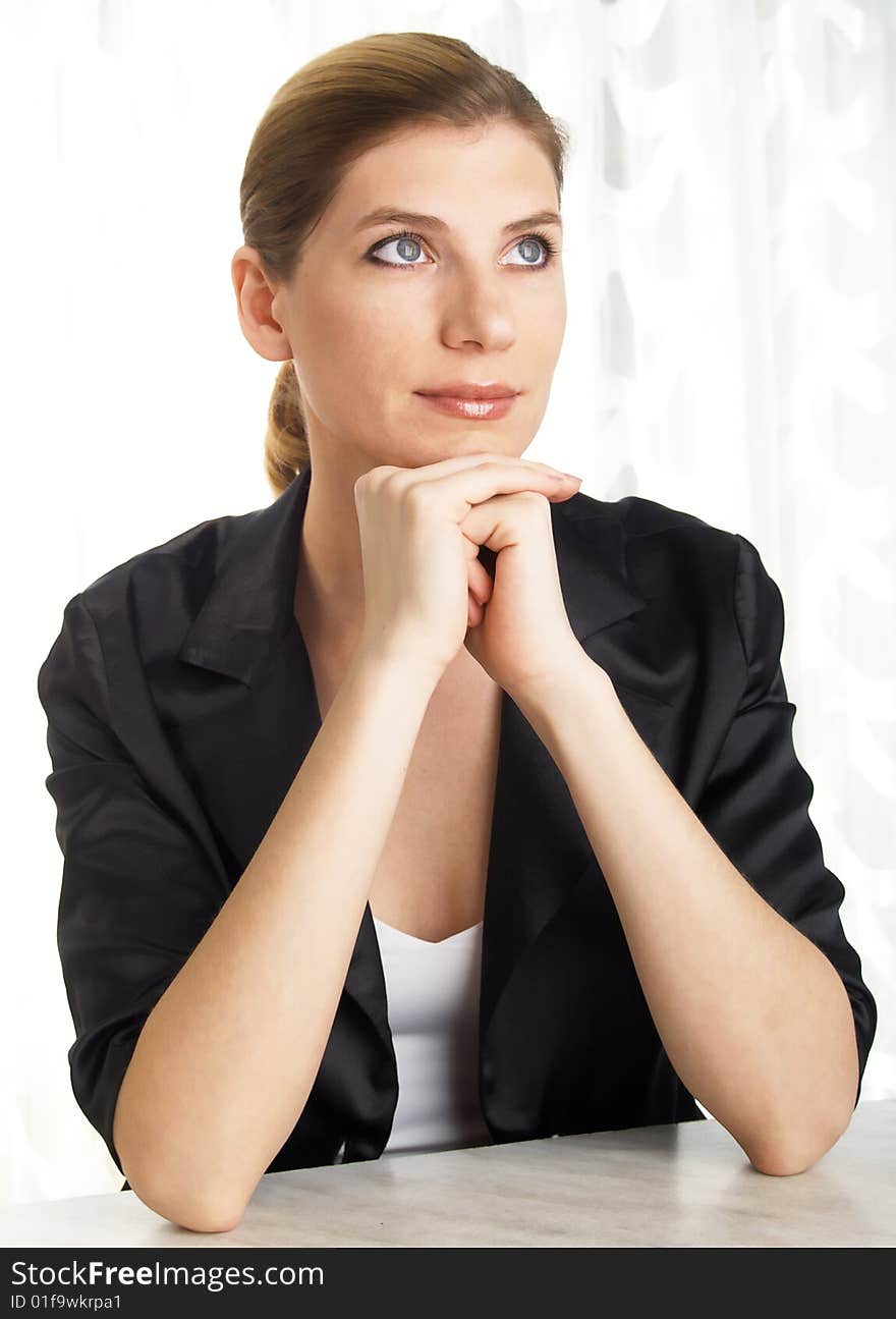 The beautiful businesswoman in a black jacket. The beautiful businesswoman in a black jacket