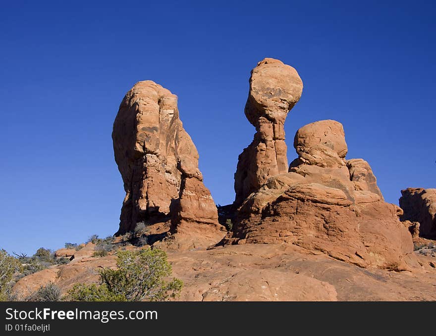 View of the red rock formations in Arches National Park with blue sky?