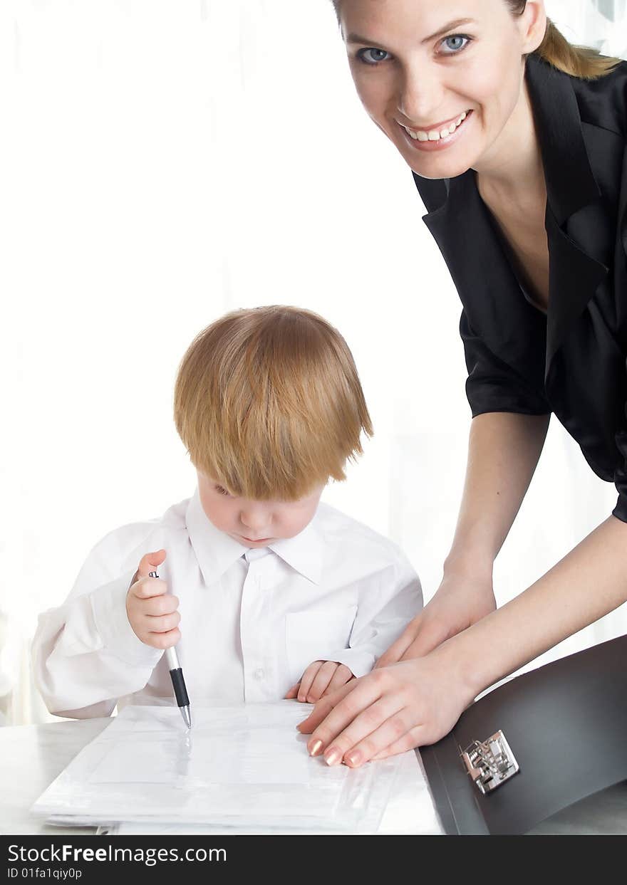 The beautiful businesswoman in a black jacket and boy. The beautiful businesswoman in a black jacket and boy