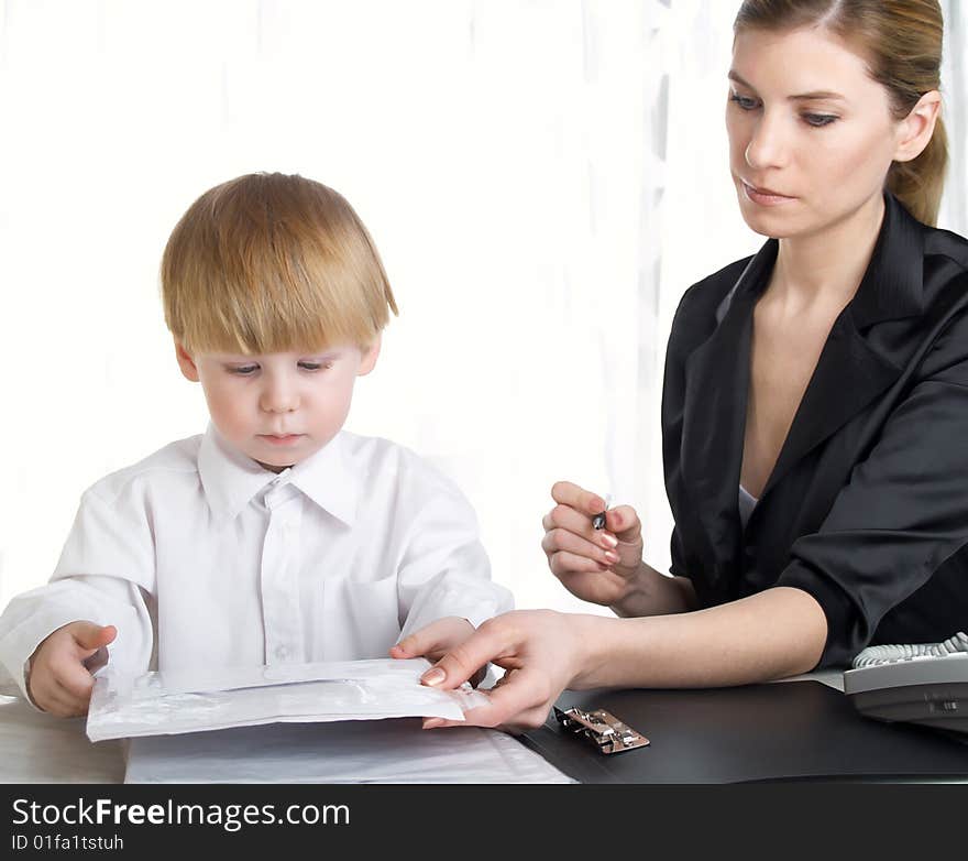 The beautiful businesswoman in a black jacket and boy. The beautiful businesswoman in a black jacket and boy