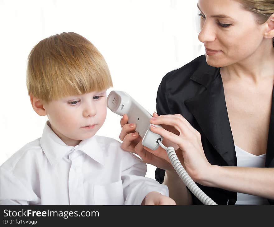 The beautiful businesswoman in a black jacket and boy. The beautiful businesswoman in a black jacket and boy