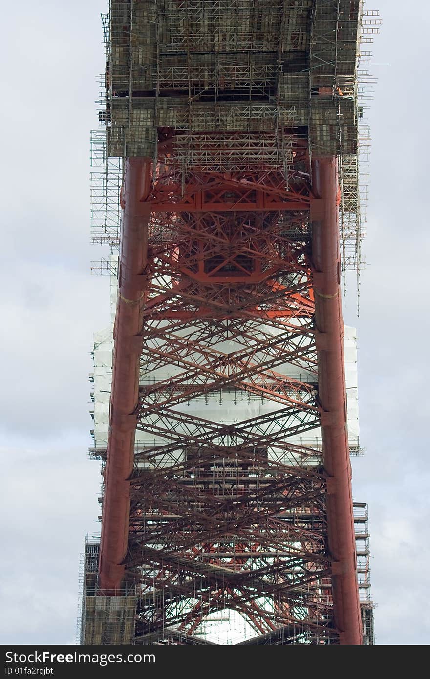 The intricate mesh of modern scaffolding and the over-engineered structure of the Forth Rail Bridge, which spans the Firth of Forth in Scotland. The intricate mesh of modern scaffolding and the over-engineered structure of the Forth Rail Bridge, which spans the Firth of Forth in Scotland