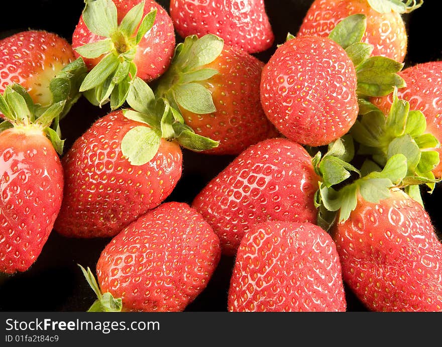 Fresh Strawberries on black ground