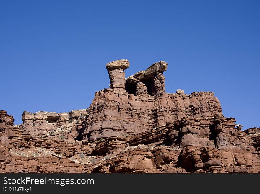 View of the red rock formations in Canyonlands National Park with blue sky�