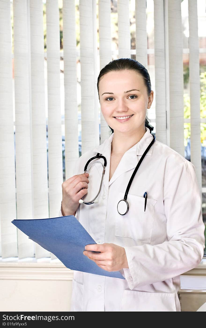 Portrait of female doctor standing