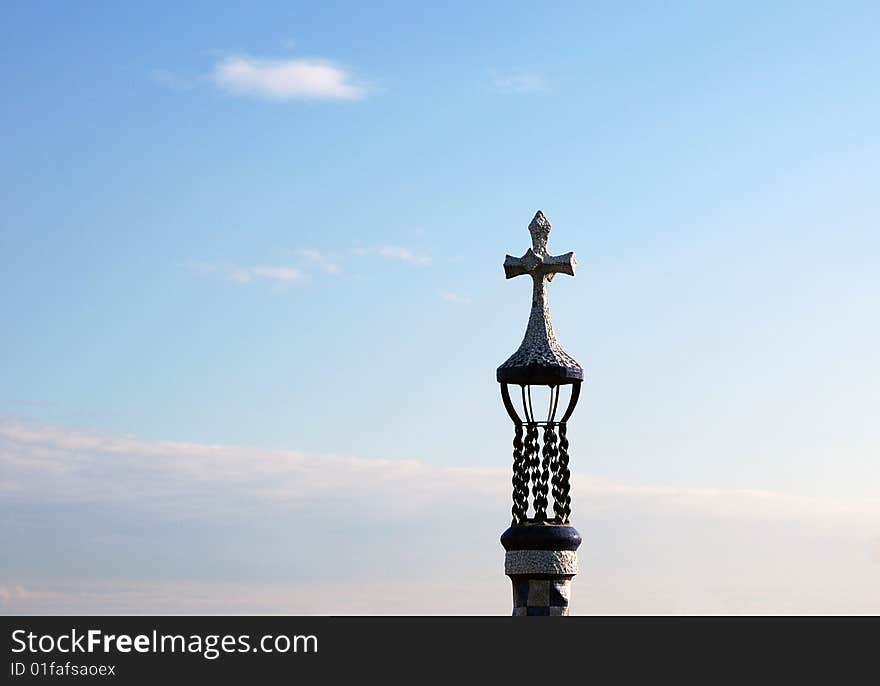 Christian cross against the blue sky background. Religious symbol of Christianity.