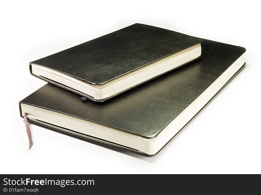 Two blacks notebooks with soft shadow on white background. Two blacks notebooks with soft shadow on white background