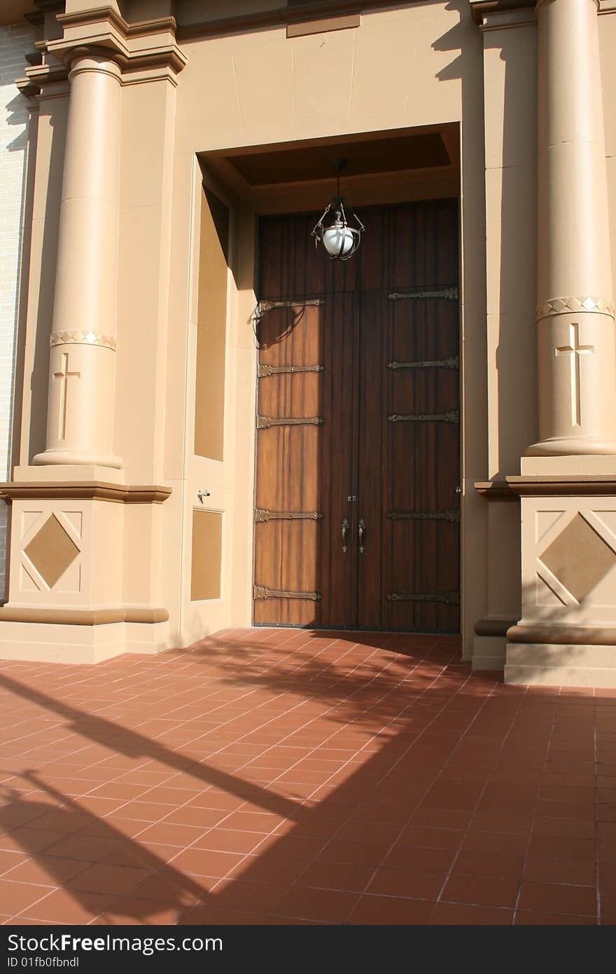 Elaborate church entry with beautiful ornate wooden doors. Elaborate church entry with beautiful ornate wooden doors.