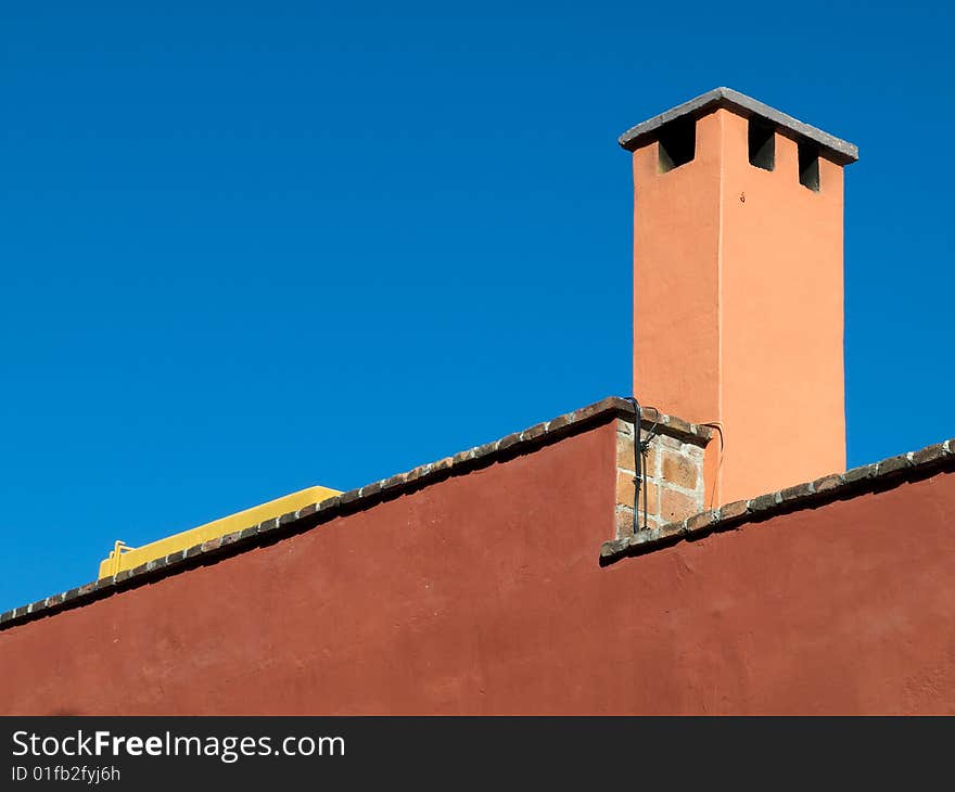 House detail showing chimney stack, San Miguel de Allende, Mexico. House detail showing chimney stack, San Miguel de Allende, Mexico.