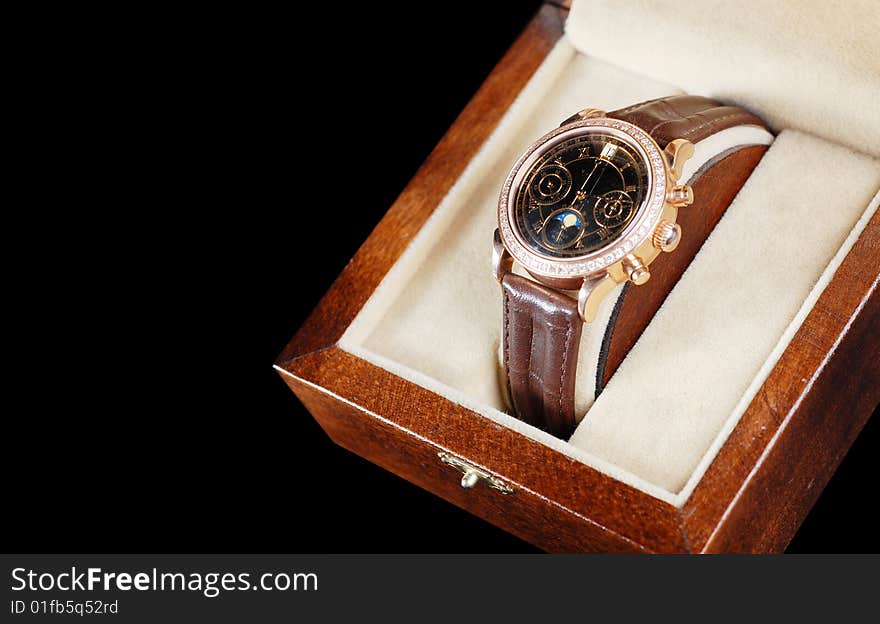 Jewelry wristwatch with leather bracelet in wooden box. Jewelry wristwatch with leather bracelet in wooden box