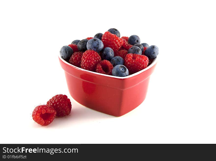 Close up of blueberries and raspberries. Shallow depth of field. Close up of blueberries and raspberries. Shallow depth of field