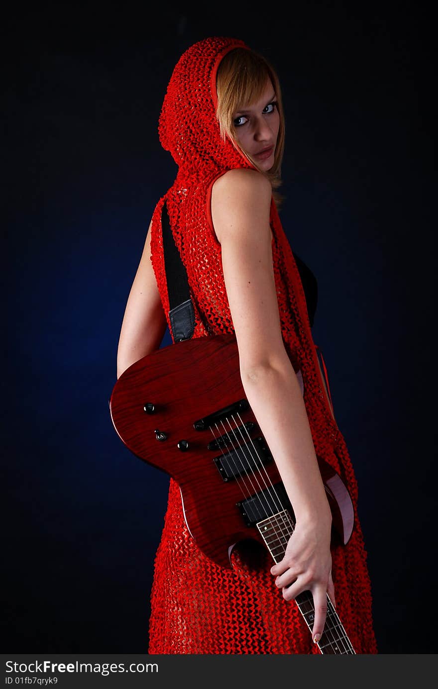 Portrait of a young woman with red electric guitar. Portrait of a young woman with red electric guitar