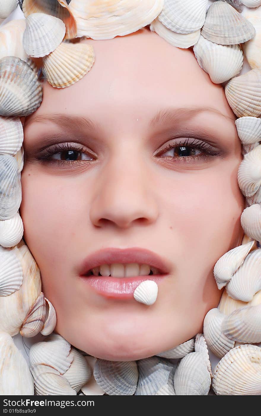 Portrait of beautiful woman with dried roses around her face. Portrait of beautiful woman with dried roses around her face