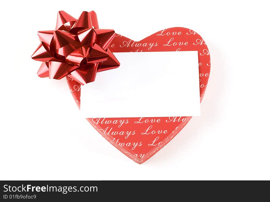 Red heart with ribbon on white background