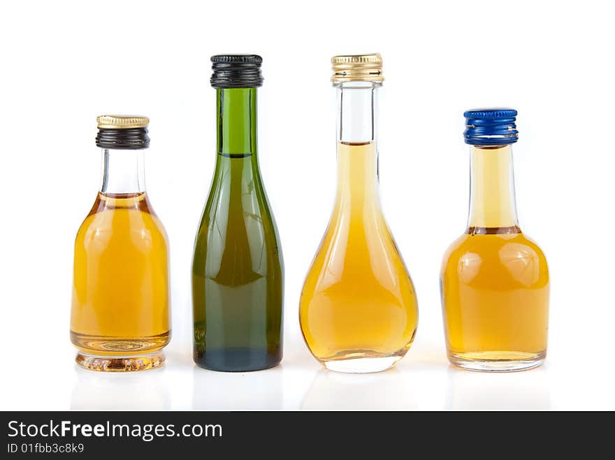 Full minibar bottles isolated over white background