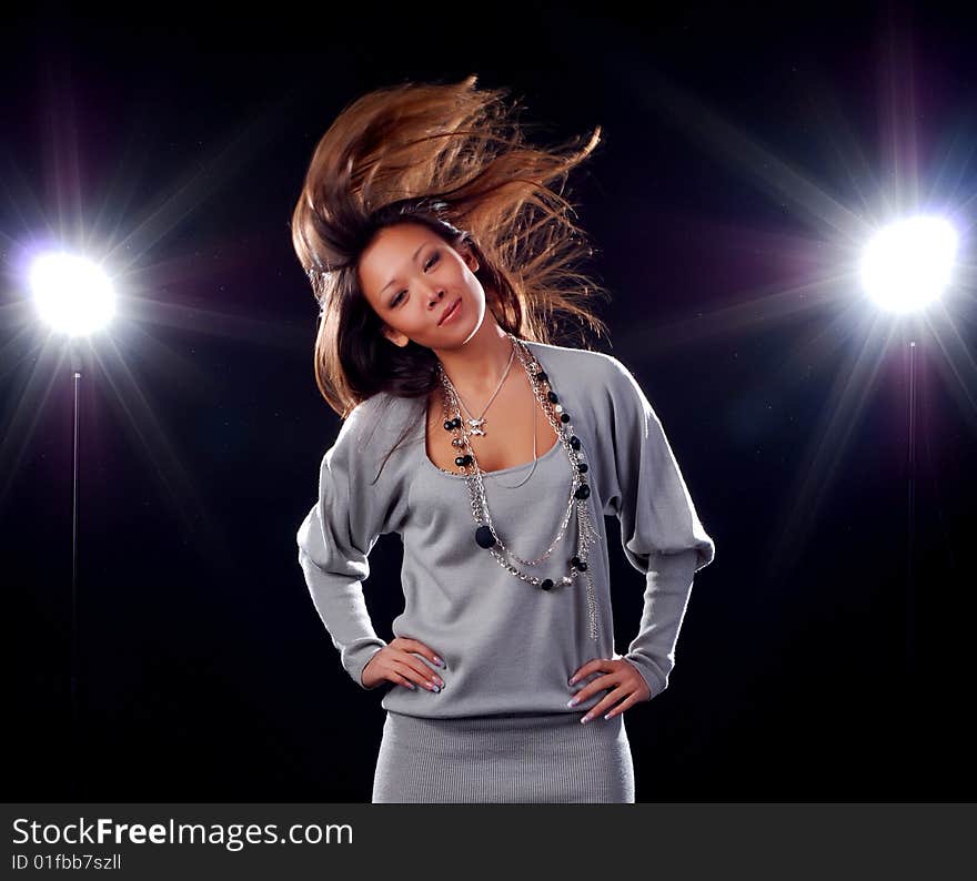 Portrait of a beautiful young woman on black bacground