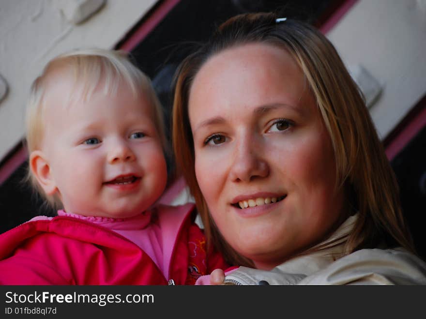 Mother with a little girl on hands. Mother with a little girl on hands