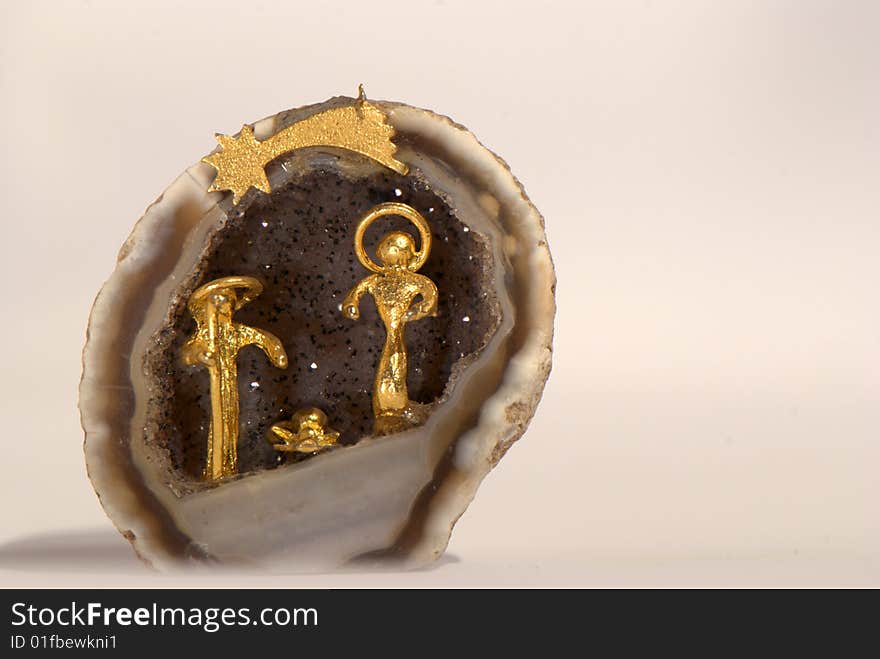 Golden nativity into a little geode