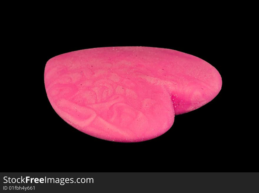 Nice pink eraser isolated on black