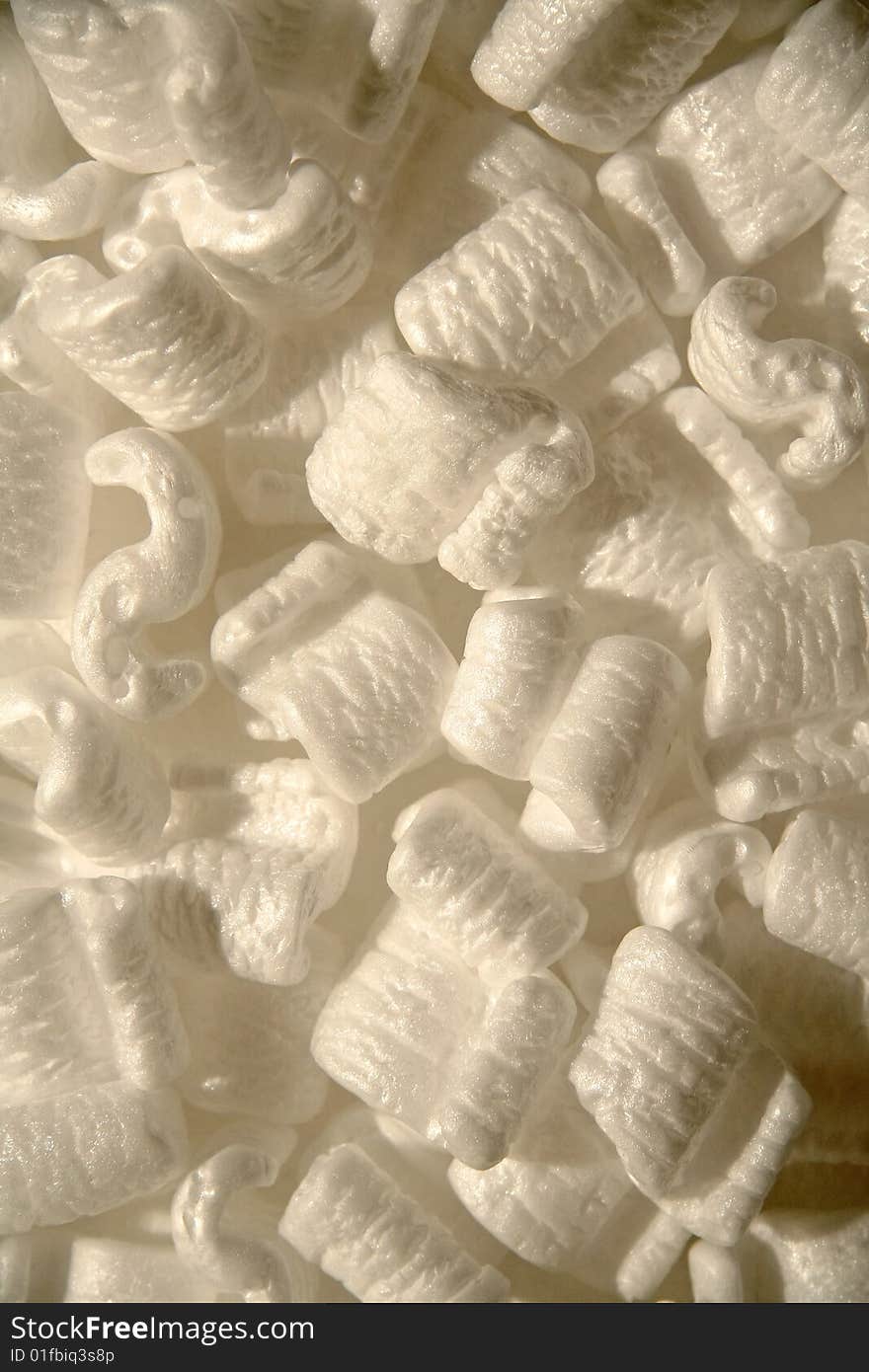 Several white styrofoam packing peanuts close up shot. Several white styrofoam packing peanuts close up shot