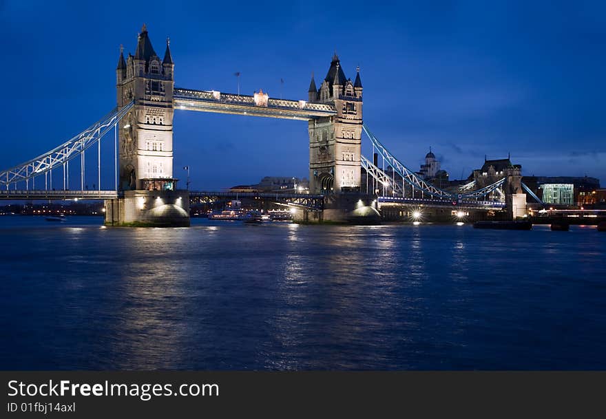 Tower Bridge in London at night and the River Thames. Tower Bridge in London at night and the River Thames