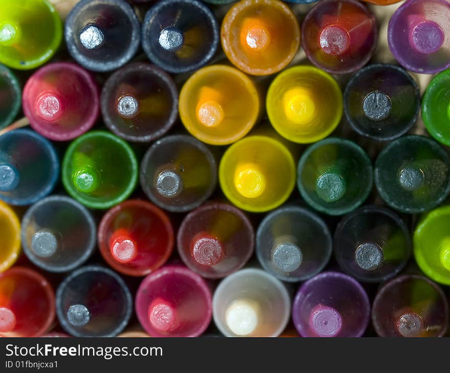 View of a pile of crayons photographed from the tips.