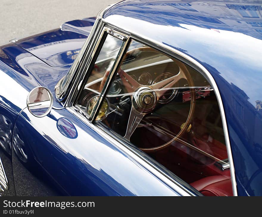 Old blue car with mirror