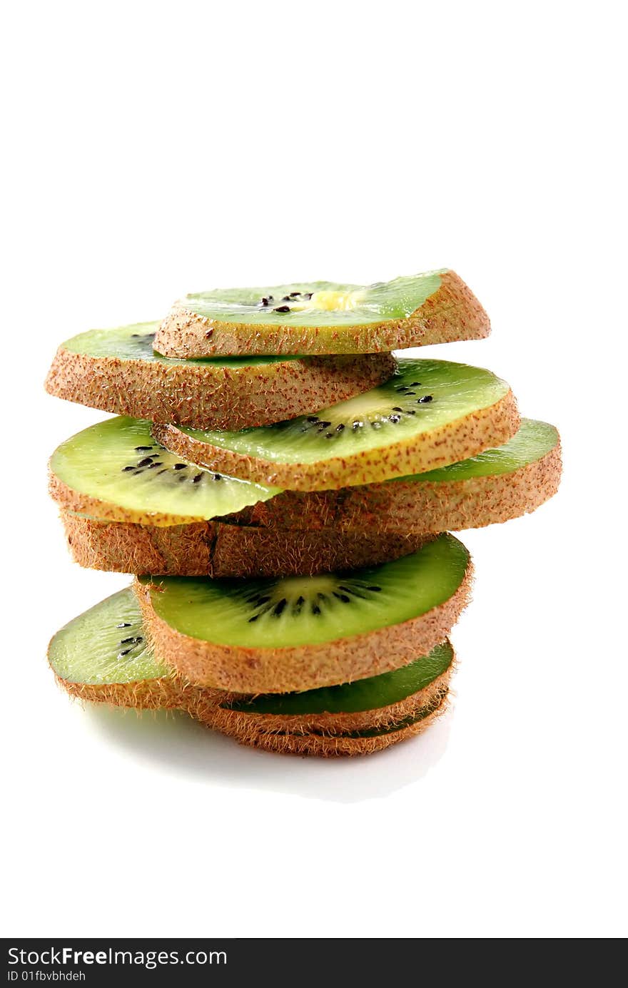 Beautiful green texture consisting of slices of kiwifruit on a white background