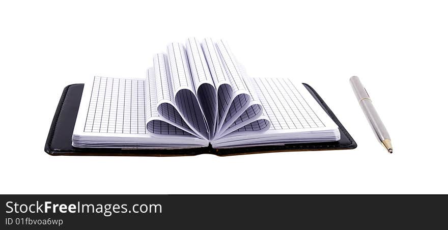 Notebook and a silver pen isolated on a white background