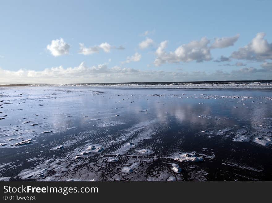 The waves with reflection crashing in on ballybunion beach ireland. The waves with reflection crashing in on ballybunion beach ireland