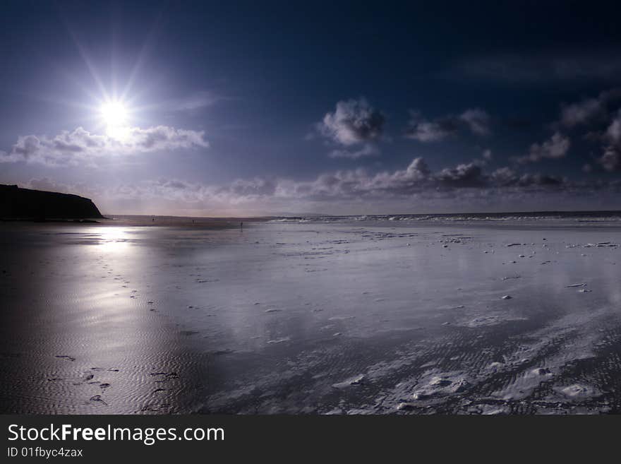 The waves with reflection crashing in on ballybunion beach ireland. The waves with reflection crashing in on ballybunion beach ireland