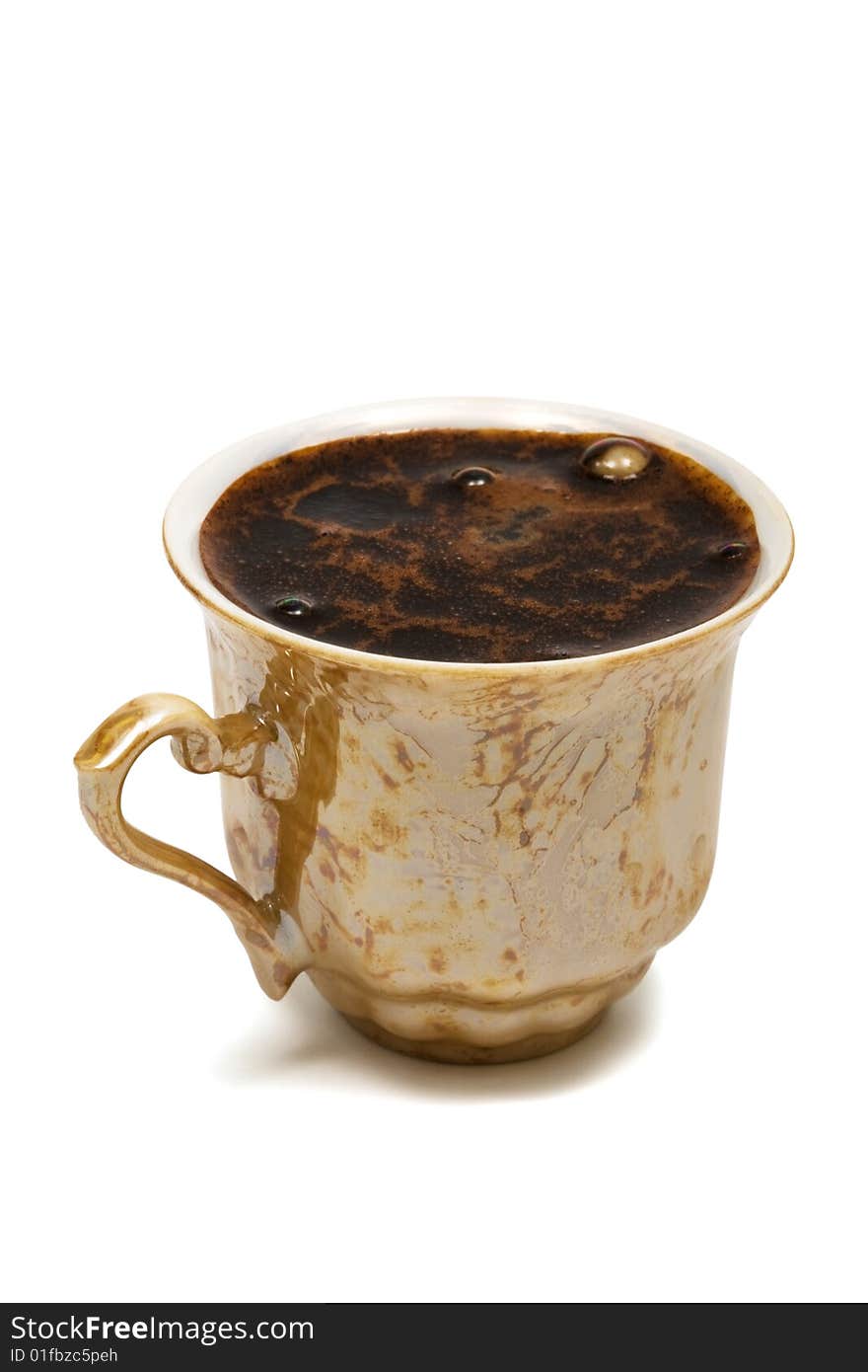 Brown mug from coffee on a white background