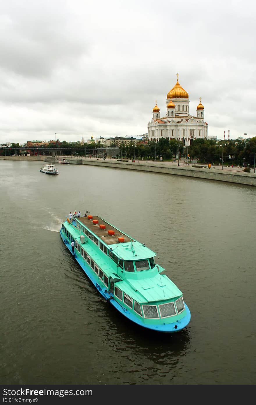 The vessel moves across the Moskva River against a temple. The vessel moves across the Moskva River against a temple.