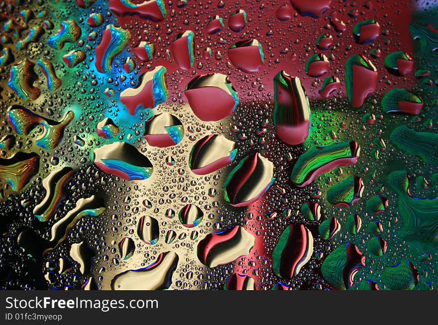 Multi-coloured drops of water. Multi-coloured drops of water