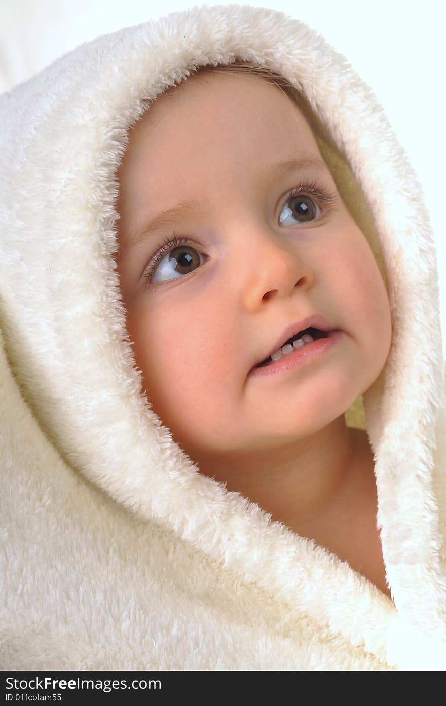 Head of  little girl in  white towel. Head of  little girl in  white towel