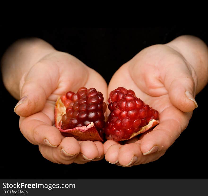 Pomegranate in hand isolated on white background. Pomegranate in hand isolated on white background