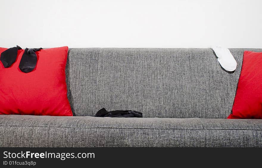 Socks in a sofa with pillows. Socks in a sofa with pillows